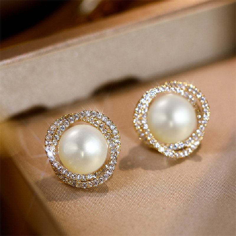 Golden stud earrings with 16mm white shell pearl -